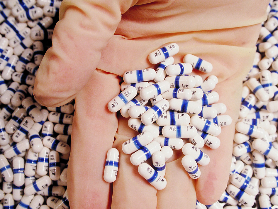   HIV/AIDS drugs like AZT are lifesavers for many people. But insurers' policies on paying for the drugs vary widely.  Will & Deni McIntyre / Science Source
